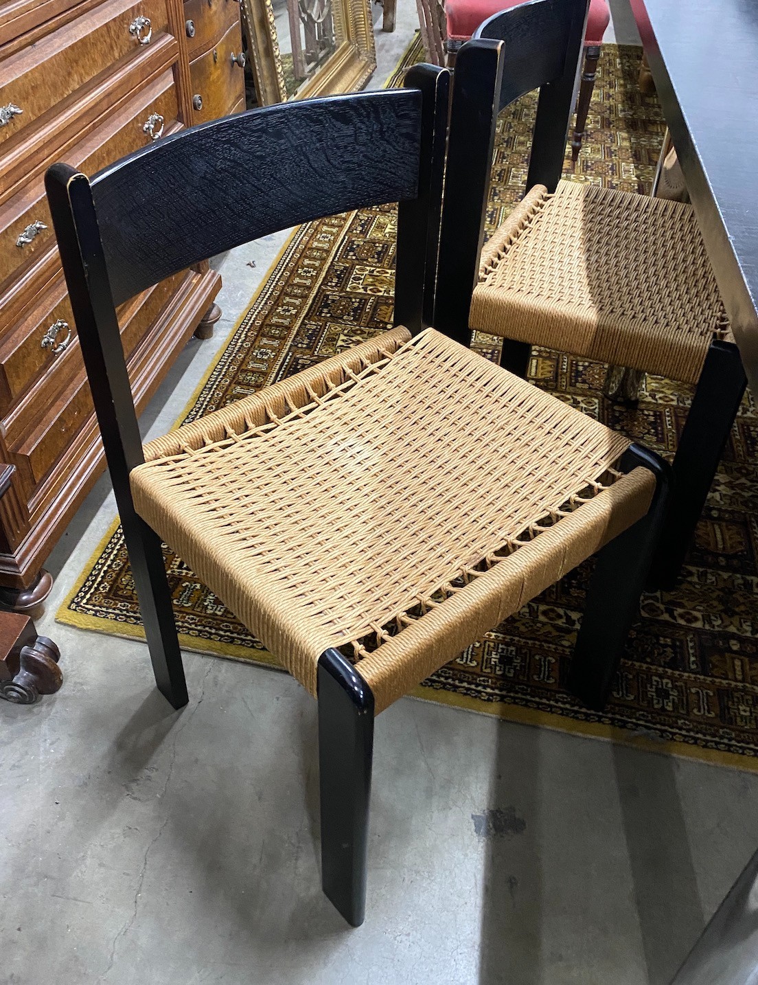 A 1970’s Habitat black ash rectangular dining table, length 194cm, width 90cm, height 74cm and four chairs, width 47cm, depth 46cm, height 79cm
